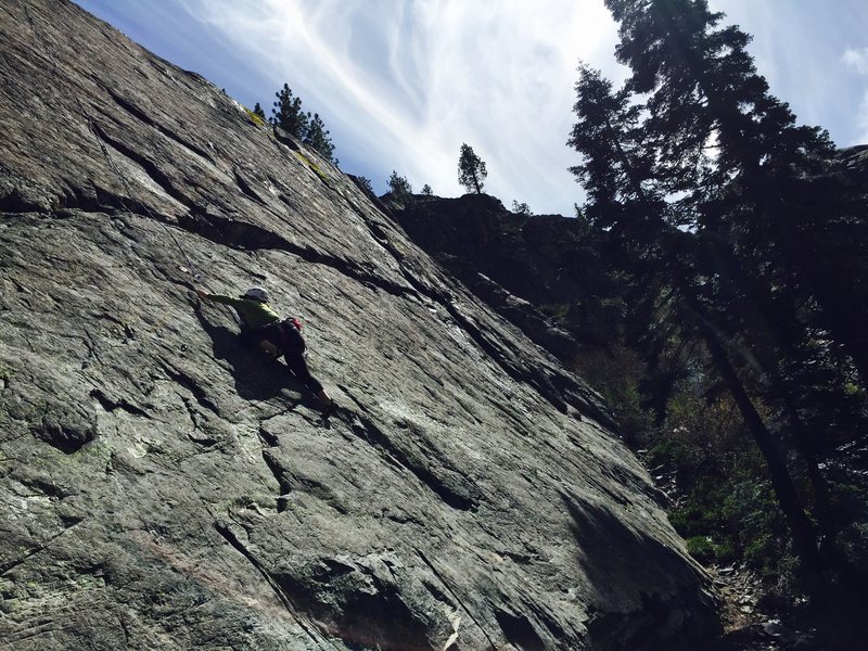 Erica cruising up an "unknown" 5.8+ at the Fun House at Bowman Valley. 