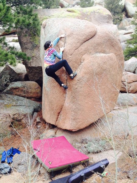 Using the amazing fingerlock/twofinger pocket in the middle of the route to pull into the exit sequence.<br>
<br>
Photo by Rob Joyce.
