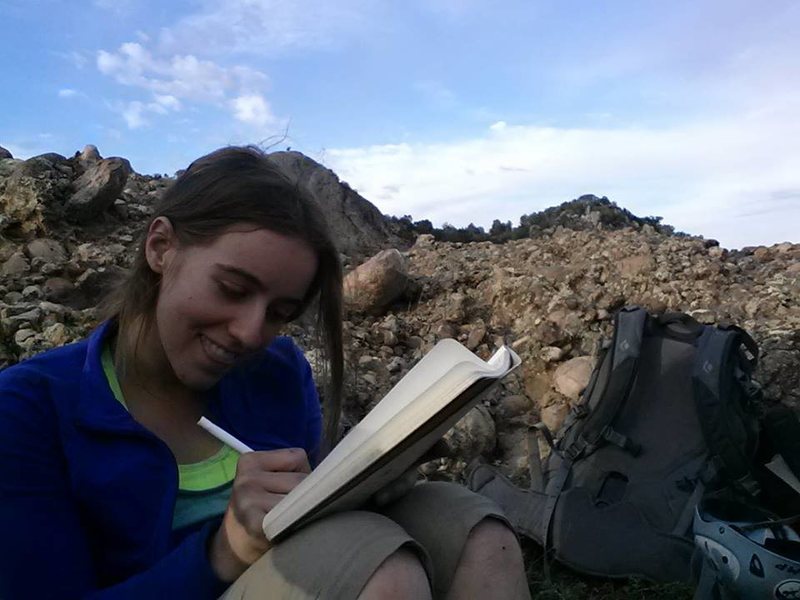 Signing the 'Heart Rock' summit journal
