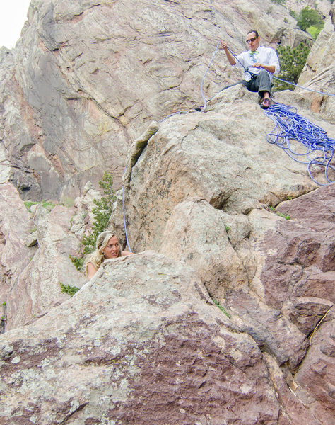 Bride Topping out the Bomb with Groom belaying - Eldorado Canyon State Park