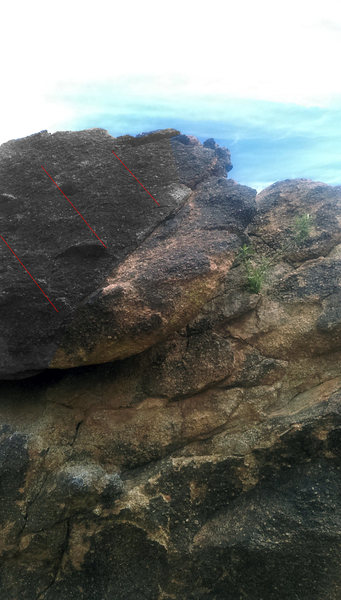 Right edge of top boulder. This edge starts at the crack.