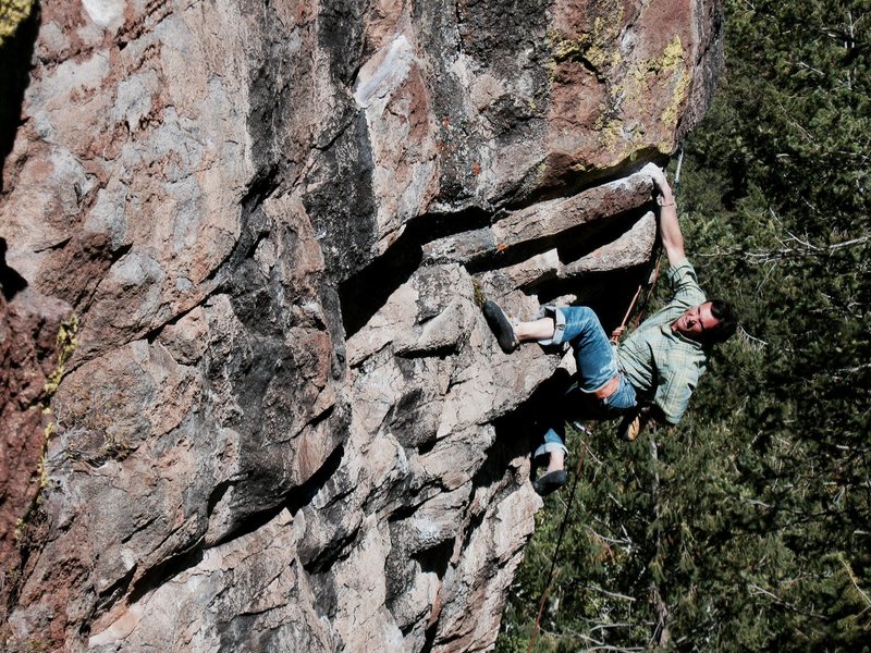 Colin unloading before the final boulder problem which guards the anchor on Burning Point .12b, The Peak’s Crag.