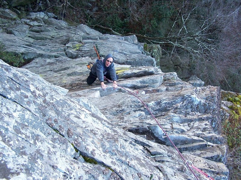 Dennis above the crux on pitch 2 of the first ascent.