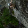 Clipping after sticking the crux deadpoint on the first ascent of Rancid Meat.<br>
<br>
Photo by Russell Frisch