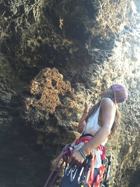 Cindy sussing the beta at a ~5.9 at Makauwahi Cave