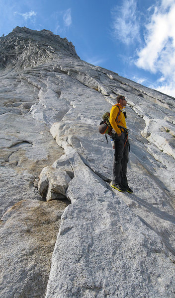 Carl Erickson contemplating approaching storm clouds midway up Tenaya's NW Buttress.