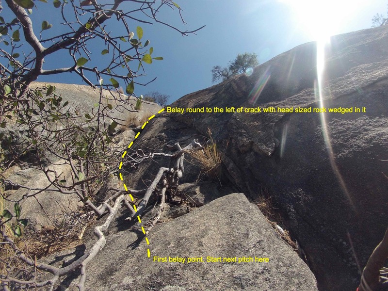 Half way point next to white tree (climb crack to the left in the V