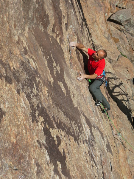 The cruiser climbing and rest before the crux on The Spark - 13c.