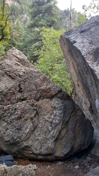 back of the flower boulder and side view of time warp on the right. As you can see there is a little route on the back of the flower boulder. v0, FA yours truly