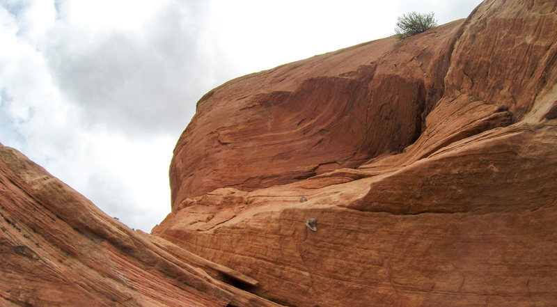 Belay bolts on the top of the second pitch. Kind of a weird positioning for the belayer.