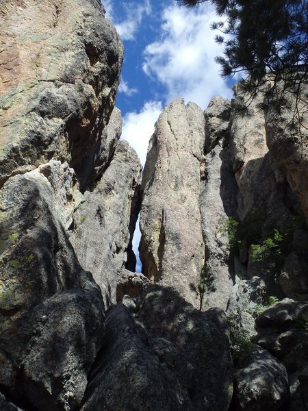 Corridor (and chock stone) that leads to the west face terraces.