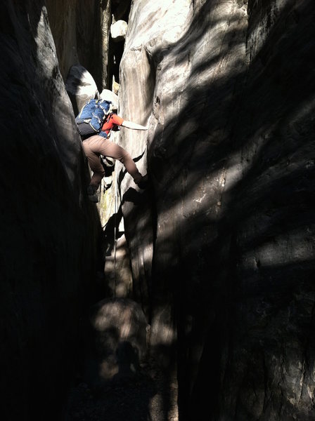 Xavier chimneying up the slot canyon approach.