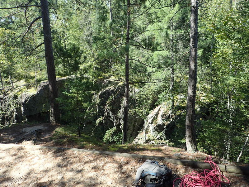 The trees along the trail to set up your anchor. This spot is immediately as the trail starts downhill again after the climb from the boat dock.
