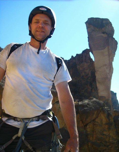 Aaron Parker standing on the huge ledge at the second pitch of First Kiss