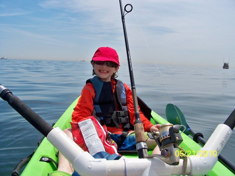 Zachary on calm waters off the Jersey Shore. Note the rods are out and we are trolling for bluefish. 