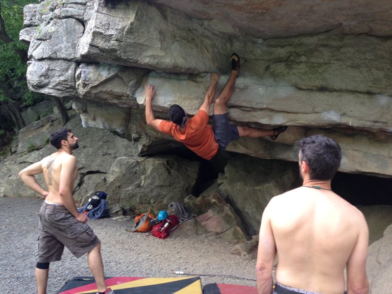 Me attempting the Andrew Boulder Problem. Shortly after this picture was taken I fell square on my back trying to pull through the crux