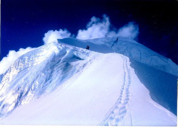 Carl Oswald busting through the hanging serac on Icing Peak's North Ridge.