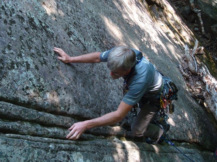 Female Mountain Climber On A Rock Face High-Res Stock Photo - Getty Images
