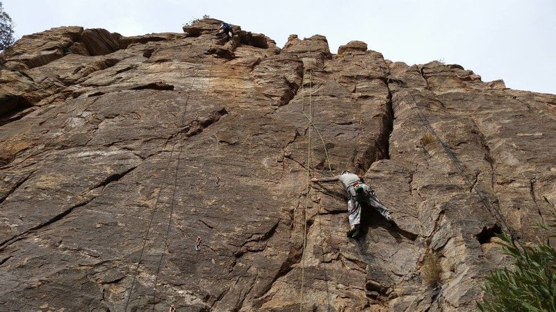 Abby on Hip Checker which shares the start with System 3 Crack, the obvious right-angling crack above her. The rope to her right is on the anchors for System 3 Crack and Two For One.