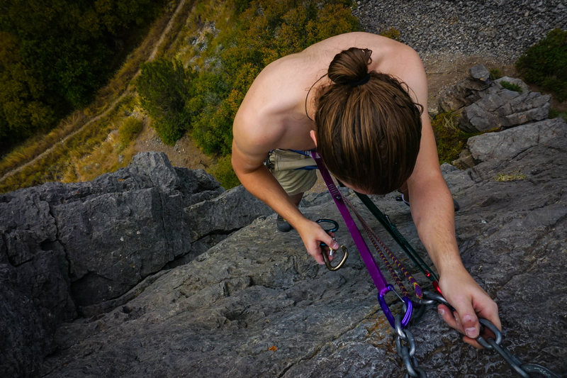 Setting up a rappel from the chains at The Lost Bolt