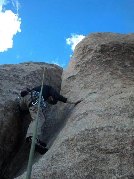 Hagny working the crux, looking for crimps.