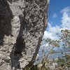 Iguana drive. 25 ft Overhanging coral stone very sharp, watch your finger, is part of the same wall at Pelican Cove with Boulder or solo climb possibilities, but climb carefully the fall is right on the below cliff pads are necessary..