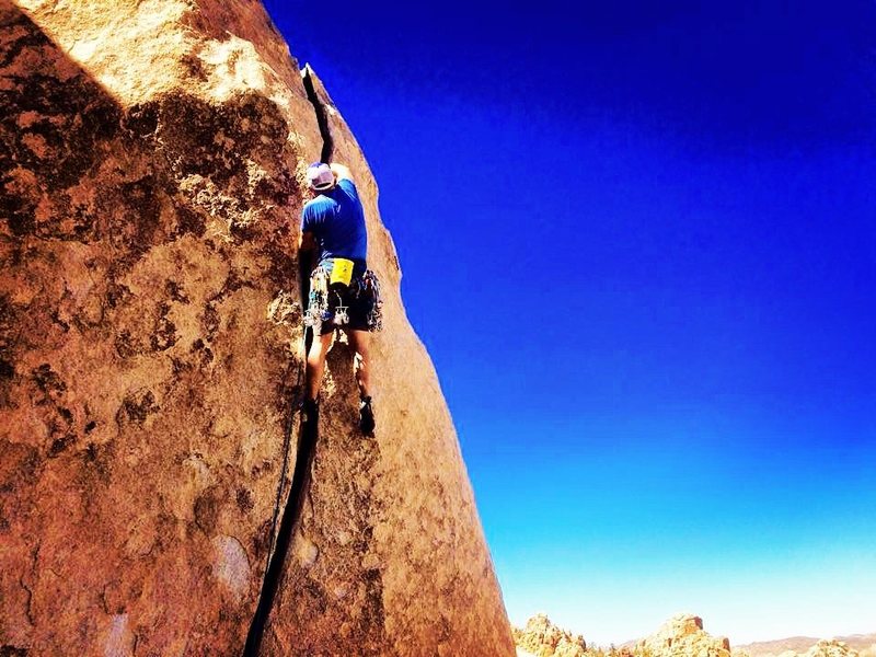Pulling the last few fist jams before the layback finish. If only it were 80' longer!
