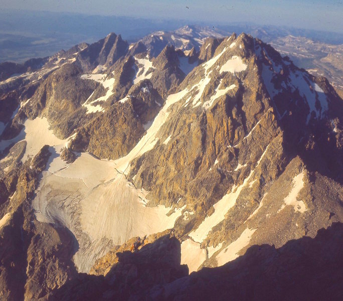 Perry-Mansfield climber (at shadows edge) high on Upper Exum Rt. 1968.