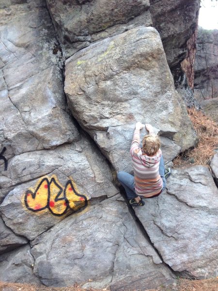 T. Miller about to dyno to the top of the route.