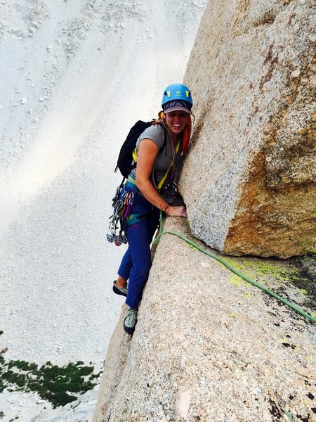 Amy Ness following the awesome & exposed hand traverse below the summit block on P5 of Schools Out