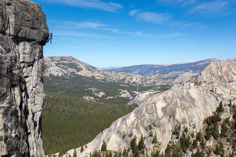 Ben Ditto climbs out the 4th pitch crux of High Times on Drug Dome, Tuolumne Meadows, CA<br>
<br>
Katie Lambert can be seen belaying at the base of the pitch.<br>
<br>
photo by Owen Bissell