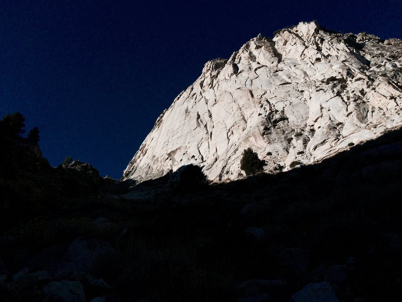 The lower east face of Wells Peak as seen from the approach. December's Children tackles a line up photo center.