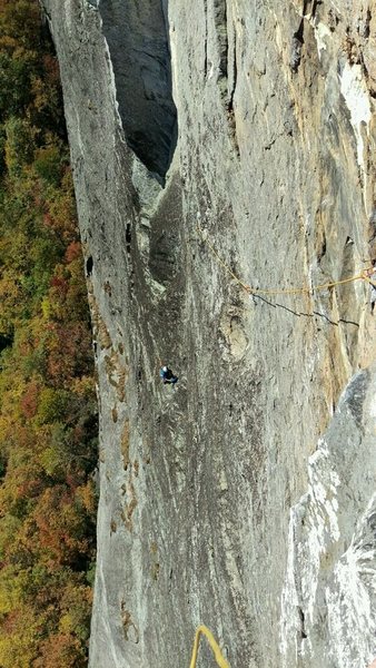 Robert atop the third pitch of Arm and Hammer, looking down at me (in the blue at the belay)