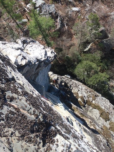 View of Tim belaying below the White Corner. Photo taken from the "Sword of the Lord" Varation. Just after the bolt. on a nice no hands rest ledge.