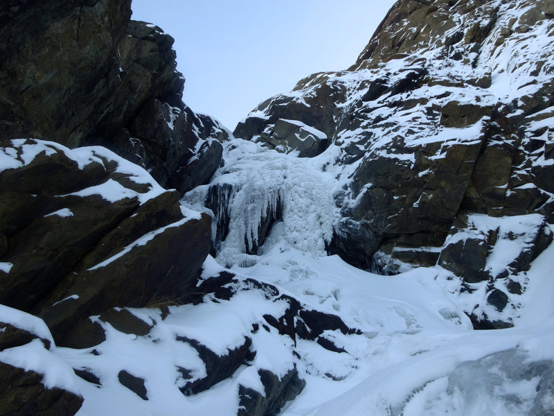 A short and steep optional ice step approaching the main flow.
