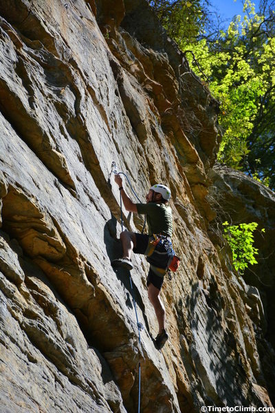 Nicholas Hernandez clipping in the rope while climbing "Return of the Manimal" in the Muir Valley section of Red River Gorge