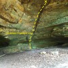 Unamed boulder problem, in a fairly large cave. Follow crack in middle about halfway up. Easy, V0 