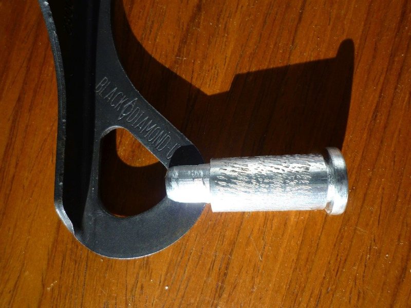 Aluminum spindle and semi-knurled aluminum knob/collar. This particular one has a bit too much axial play.