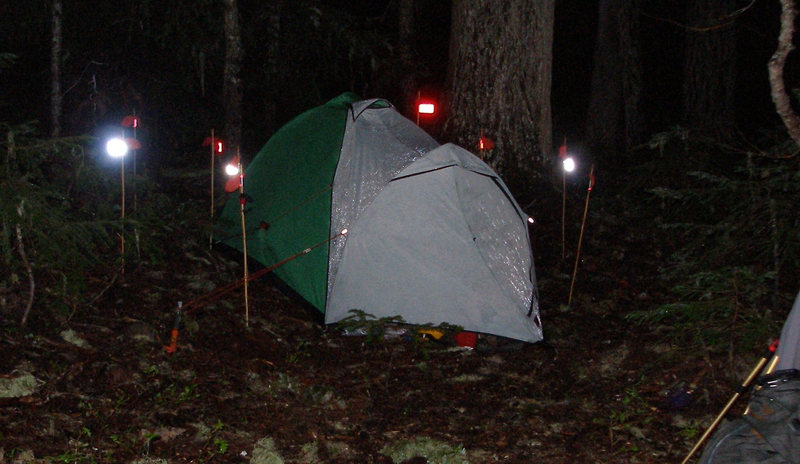Photo nor as dorky as it looks...maybe dorky, but was<br>
wand experiment below Rainier Cleaver route, 2001. Red/white rectangular flagging at rear of tent is the flag to focus on. The white is too bright to look at and that's the point: perfect for all seasons travel. Note: wands used for other things, i.e., marking tent tension lines, stakes, etc. Mere presence prevents tripping in the dark.
