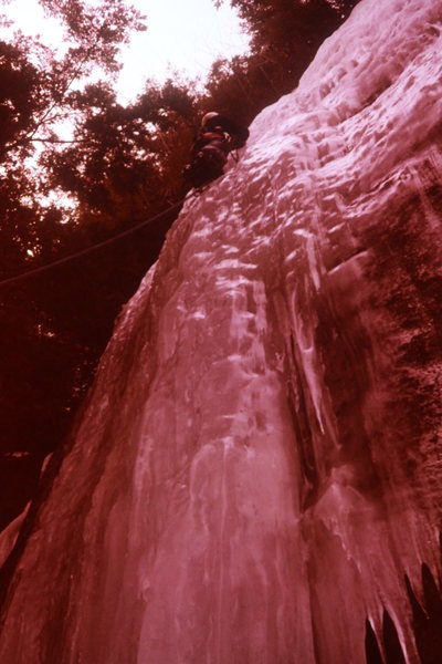 Corky Munn on an ice route. Even though Farley is a south face. In a cold year, it has good ice.