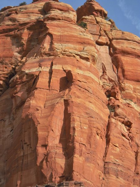 Thumbs Up from below. Starts in the long shaded dihedral, goes left into the 2nd dihedral and up right to the obvious seam in the headwall.