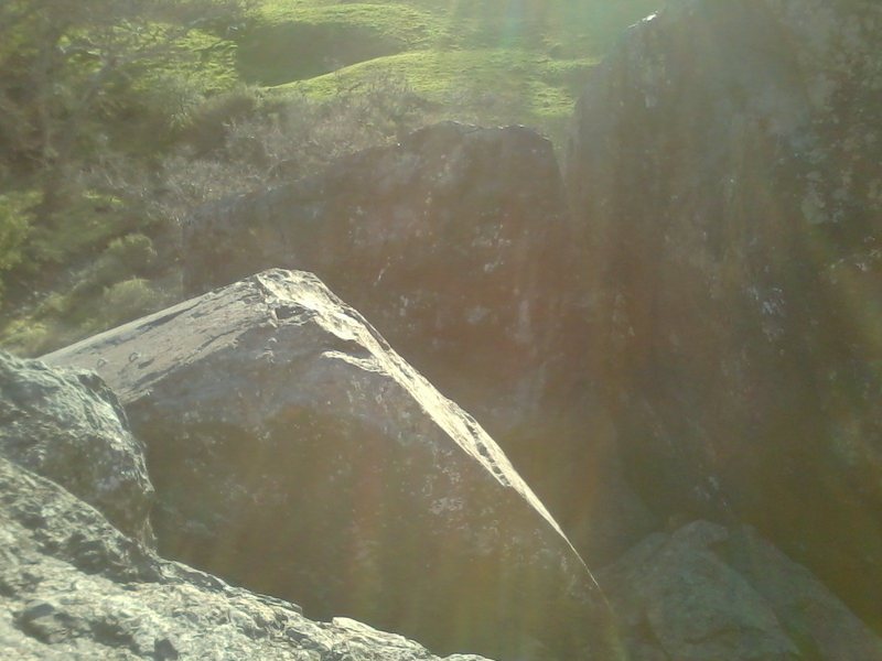 Bolts for Freeway 5.6, Face it 5.10c and Pull Up 5.10b as seen from the top of the Northeast Boulder