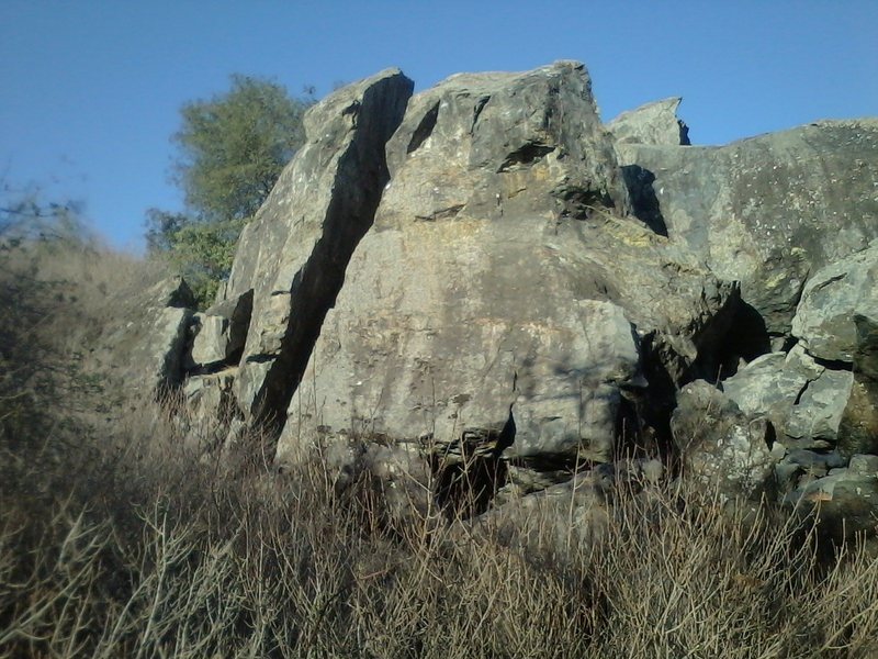 Another view of the three face climbs on the Northwest boulder (Left Side) viewed from the south. The Cleavage is the obvious chimney in the middle and there is a 5.8 face climb just to the right of the Cleavage. The Ramp 5.7 is further to the right.