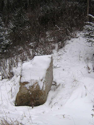 The "trail head" is at 44°20'24.6"N 73°53'25.4"W. It's marked by this boulder. About a 10 min approach to the climb. It's on the right as you drive from Lake Placid to Whiteface ski resort.