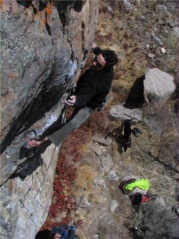 The route's crux sequence with an appearance from Frank in the background.