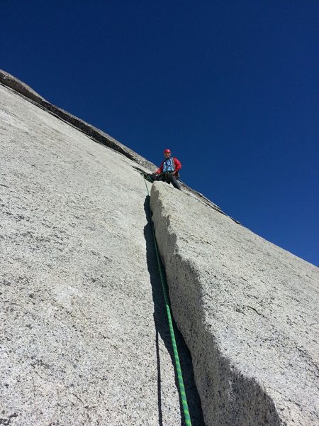 This is the 5.5 section on the 1st Pitch if you are going to the 60 meter rope belay station. If you have a short rope, it would be the start of the second pitch. The photo shows the crack at 37.739681, -119.539680