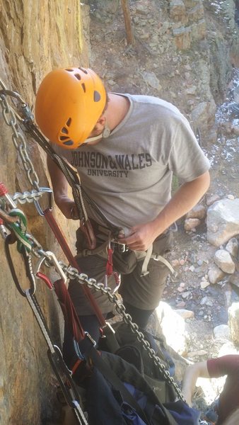 Setting up at the belay anchors. Watch out for loose rock, lots of it laying around.