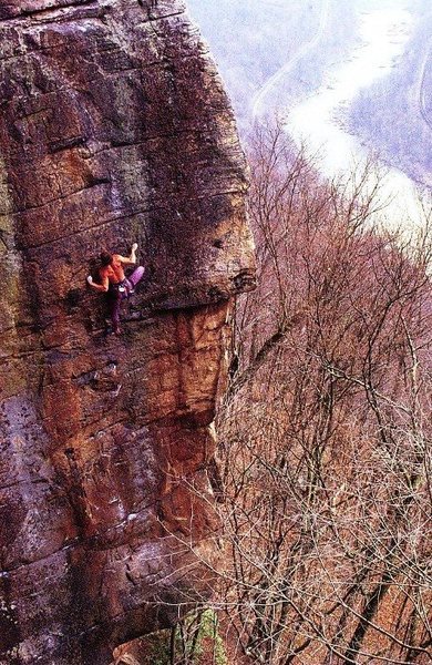 Doug Reed on Voyeur's Hand (5.12c), New River Gorge<br>
<br>
Photo by Carl Samples