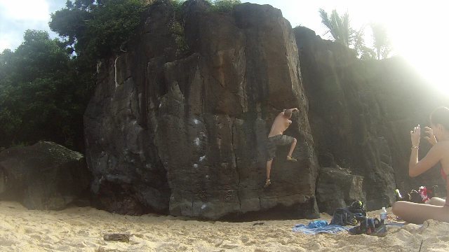 Mario Morante traversing across a damp Finger Machine Traverse in Waimea Bay during his honeymoon vacation.