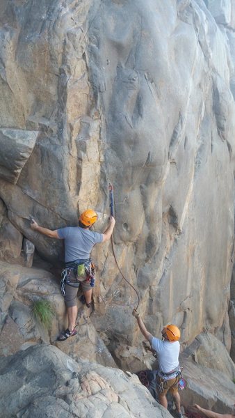 First clip of Suzie's is not so much climbing as a scramble. Please note the photographer is standing where some people setup their belay station (in other photos on Mtn Proj) which gives a better view of your climber but risks the belayer taking a dive forward during a fall.